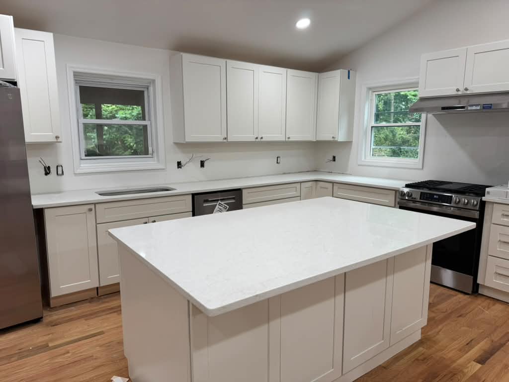 Bright white kitchen with island and custom cabinetry