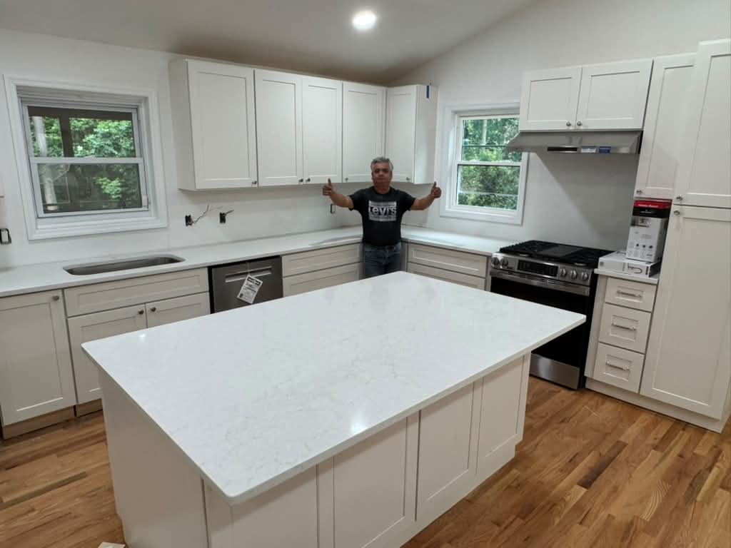 White shaker kitchen with large island countertop